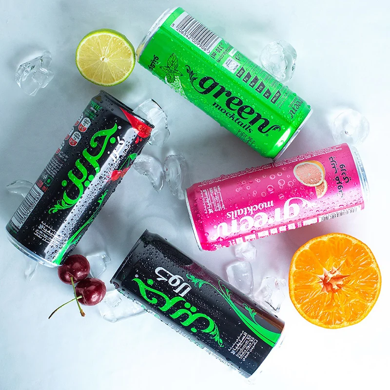 Colorful beverage cans arranged with ice and fruit